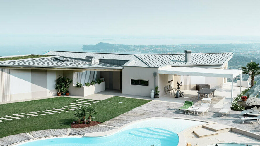 Wohnhaus in einzigartiger Lage mit Swimming Pool. Das Flachach des modernen Gebäudes ist mit Prefalz in Patina Grau eingedeckt.