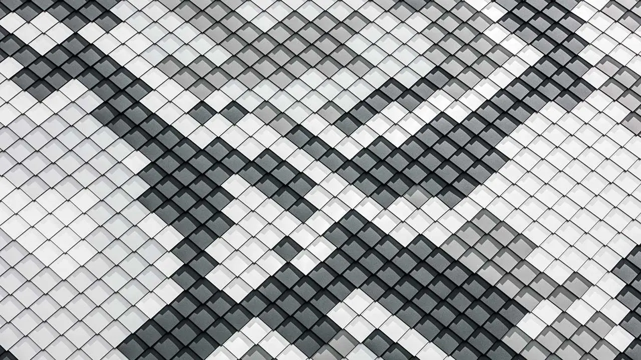 Nahaufnahme des Verlegemusters des Wohnhauses "Le Python" mit den 4 unterschiedlichen Aluminiumwandplatten von PREFA im Verlegemuster einer Schlange