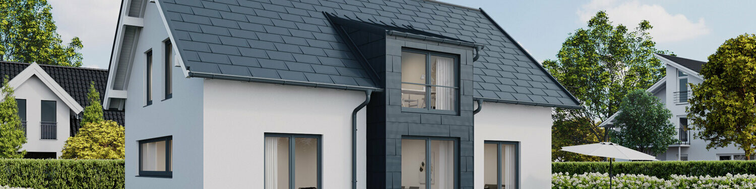 Casa unifamiliare con tetto a due falde con tegole  PREFA R.16 e pannelli per facciata FX.12 in P.10 antracite 