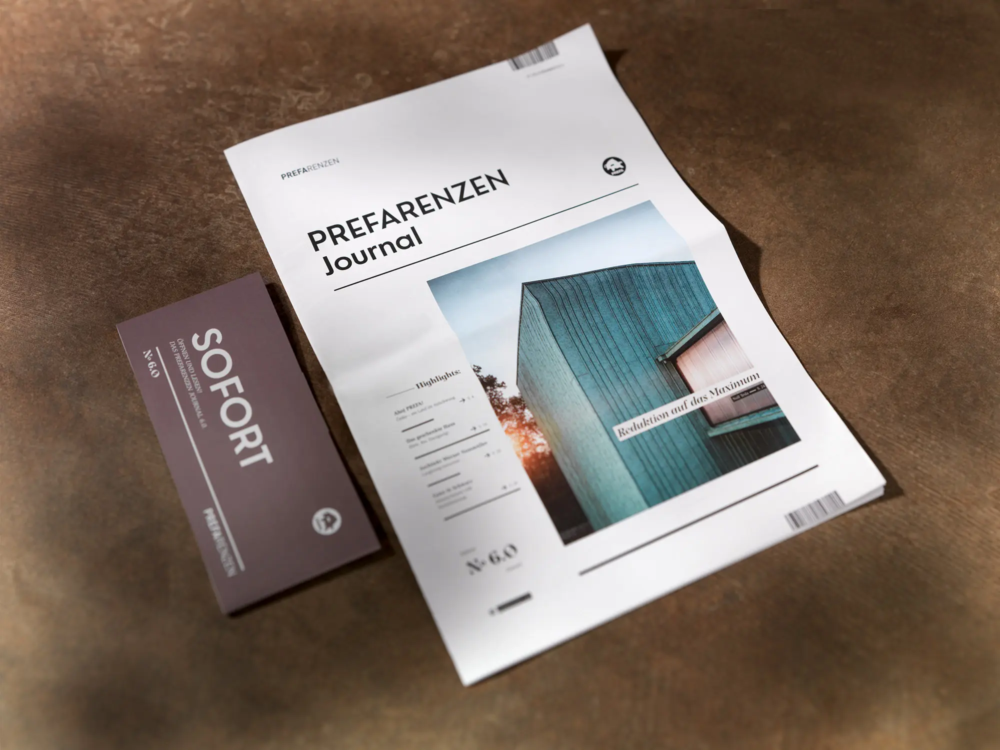 Il PREFARENZEN Journal e accanto la relativa fascetta, entrambi su base marrone.