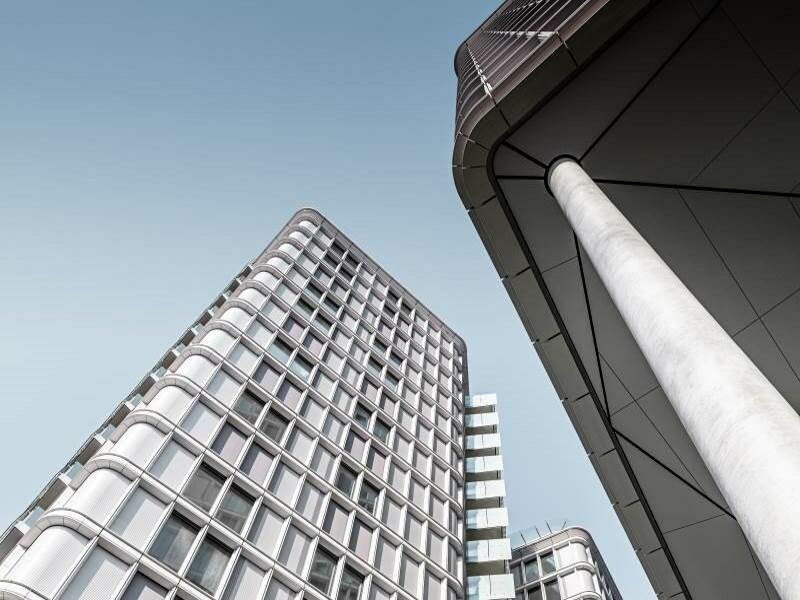 Untersicht eines Wohnturms der "Belvedere Apartments". PREFA Profilwellen schaffen eine hochwertige Fassade.